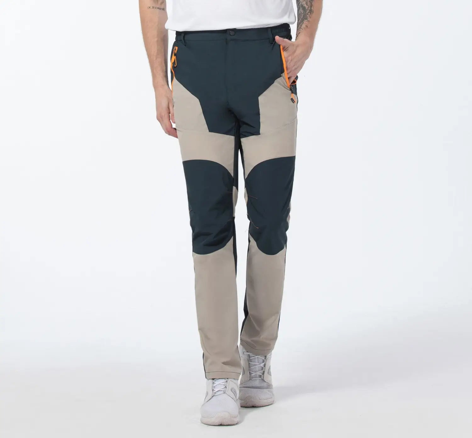 Men quick dry tactical hiking pants featuring beige and dark green panels with orange zipper accents designed for outdoor use.
