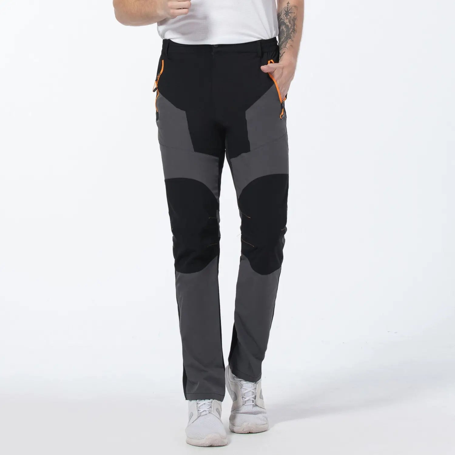 Men quick dry tactical hiking pants in black and gray with orange zipper accents designed for durability and outdoor use.