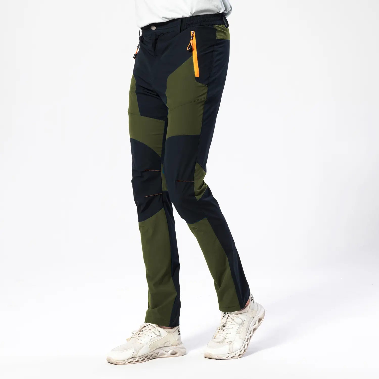 Men quick dry tactical hiking pants featuring dark green and navy blue patchwork design with orange zipper accents for outdoor use.