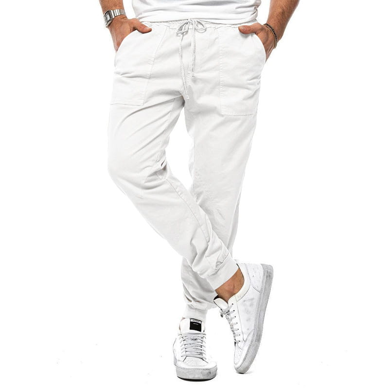 Joggeurs décontractés pour hommes à jambe fuselée blancs, avec une coupe ample, une taille à cordon de serrage et des poignets élastiques pour un port quotidien confortable.