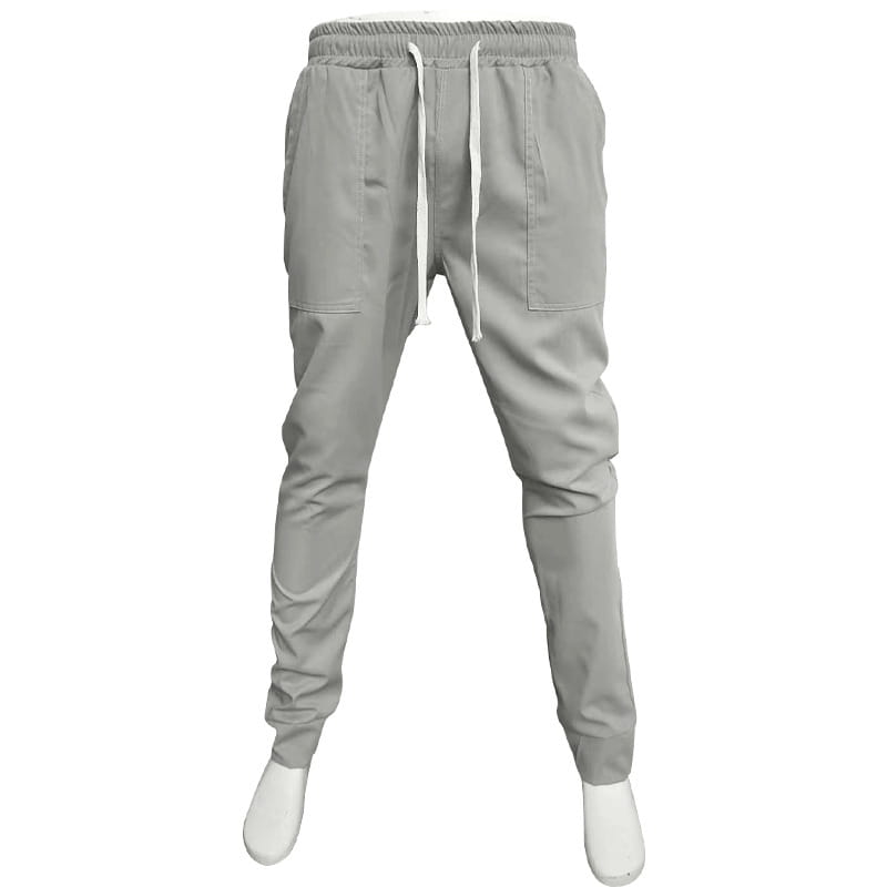 Joggeurs décontractés pour hommes à jambe fuselée gris, avec une taille à cordon de serrage, deux poches latérales et une coupe de jambe fuselée.