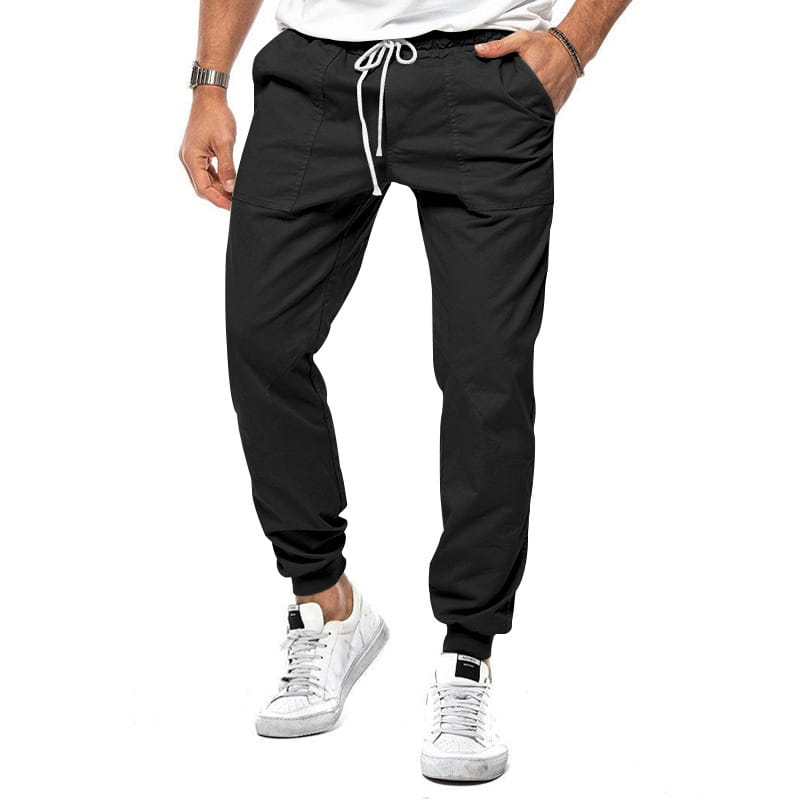 Joggeurs décontractés pour hommes à jambe fuselée noirs, avec une coupe ample, une taille à cordon de serrage et des poignets élastiques pour un port quotidien confortable.