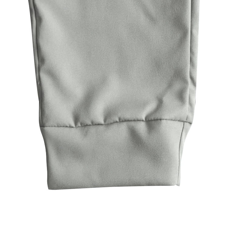 Joggeurs décontractés pour hommes à jambe fuselée en coton gris, avec la finition au niveau du poignet et un ourlet cousu propre