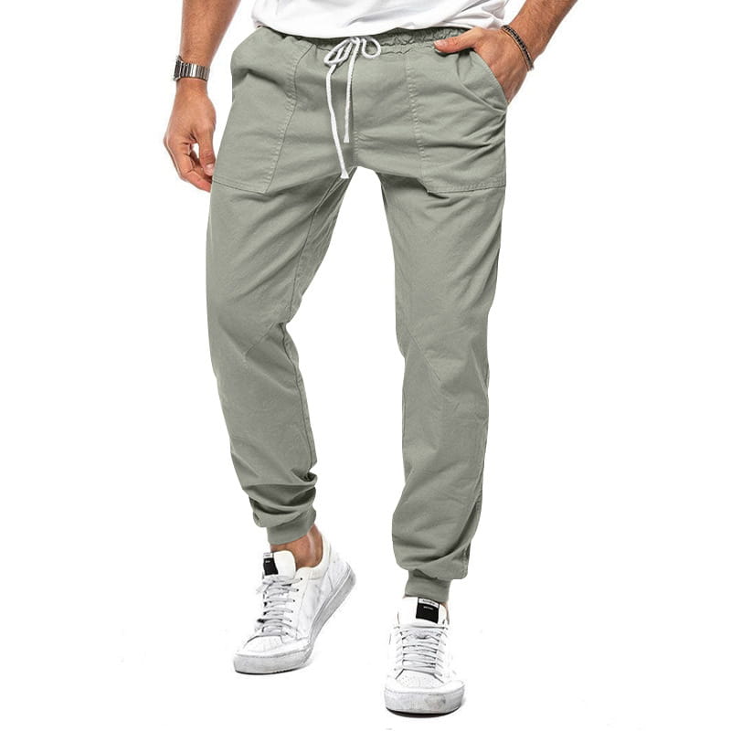 Joggeurs décontractés pour hommes à jambe fuselée vert olive, avec une taille à cordon de serrage, des poches latérales et des chevilles resserrées, pour un port quotidien confortable.