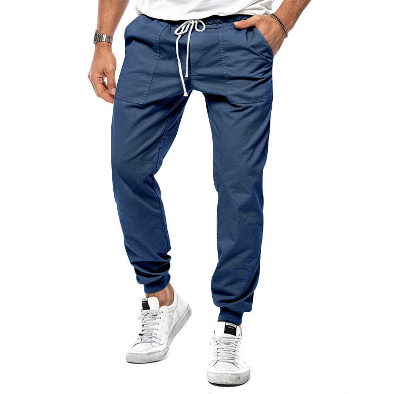 Joggeurs décontractés pour hommes à jambe fuselée bleu marine, avec un cordon de serrage blanc et des poignets élastiques, conçus pour un port confortable.