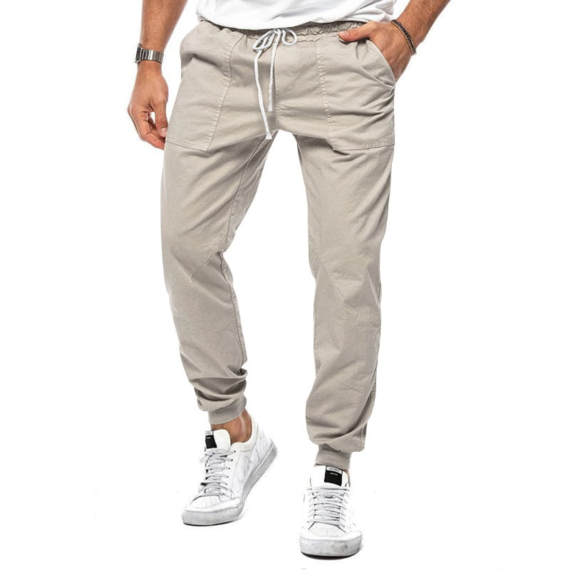 Joggeurs décontractés pour hommes à jambe fuselée beige, avec une taille à cordon de serrage, des poches latérales et des chevilles resserrées, pour un port quotidien confortable.
