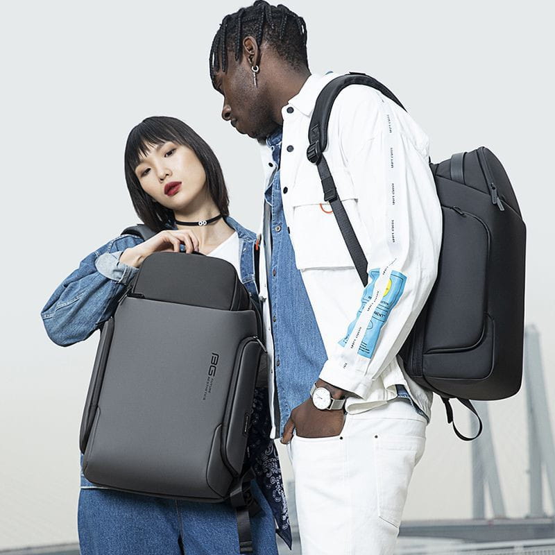 black sleek business backpack 15.6 inch waterproof laptop bag with subtle branding on the side designed for professional use