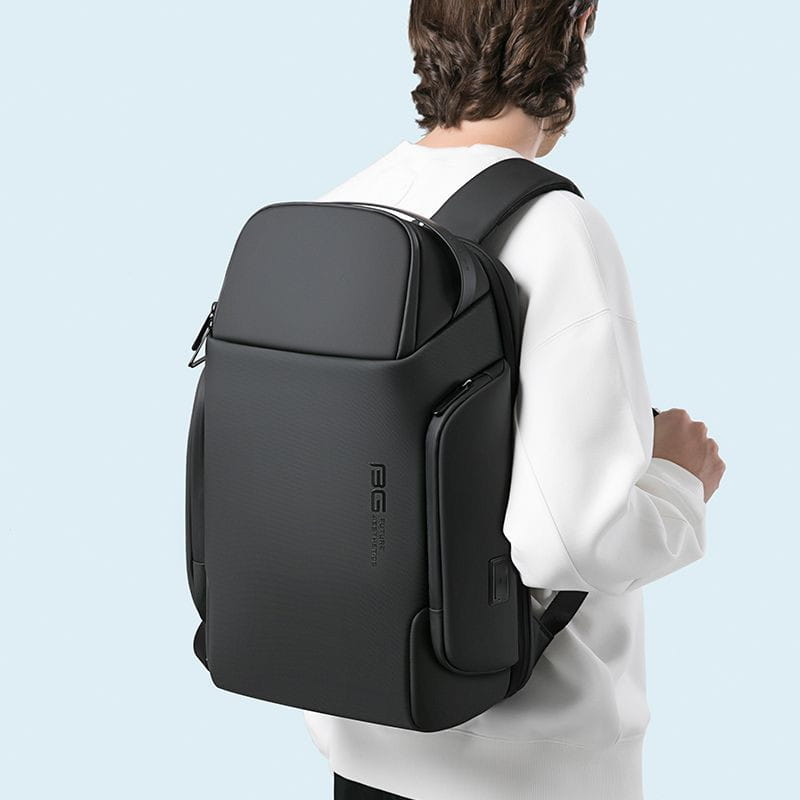 Black sleek modern waterproof laptop backpack with subtle branding on the side designed for business use and fits up to 15.6 inch laptops