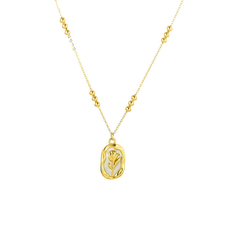 18k gold plated stainless steel necklace with a gold-toned delicate oval pendant featuring an engraved tulip design and a subtle textured finish.