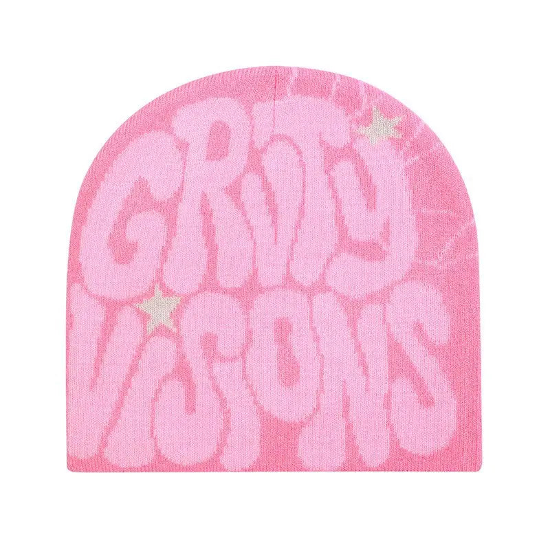 pink knit beanie hat featuring bold slightly faded groovy visions lettering and two small star accents in a soft knit material