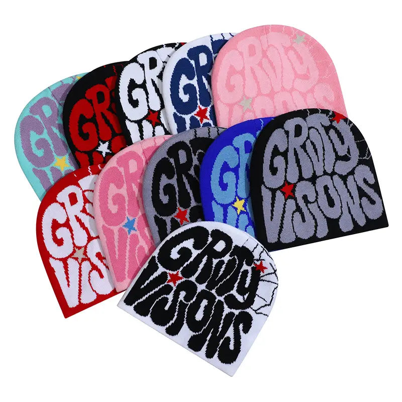 Colorful knit beanie hats in various hues featuring bold grady visions lettering and star accents made from warm knitted material.