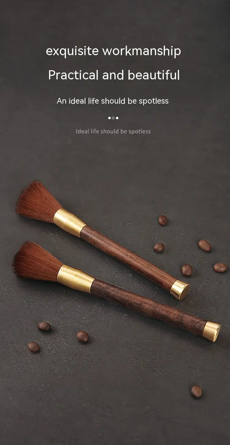 Two elegant wooden-handled coffee grinder cleaning brushes with gold-toned metal accents and dense soft brown bristles.