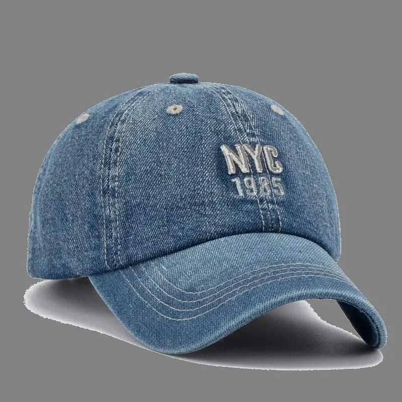 Men denim nyc baseball cap in blue with nyc 1985 embroidered in white thread on the front.