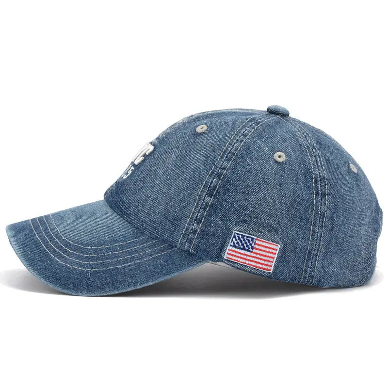men denim nyc baseball cap in faded blue wash with an embroidered american flag patch on the side