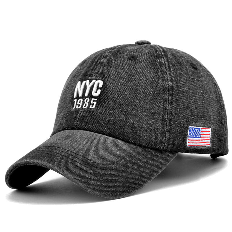 Men denim nyc baseball cap in black featuring white nyc 1985 embroidery and a small american flag patch on the side.