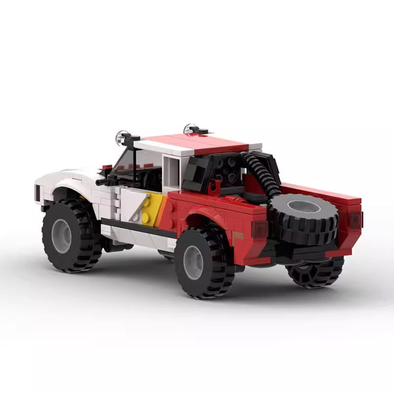 Red and white lego off-road pickup truck building block toy with black tires, spare tire mounted on the side, and yellow stripe detail consisting of 403 pieces.