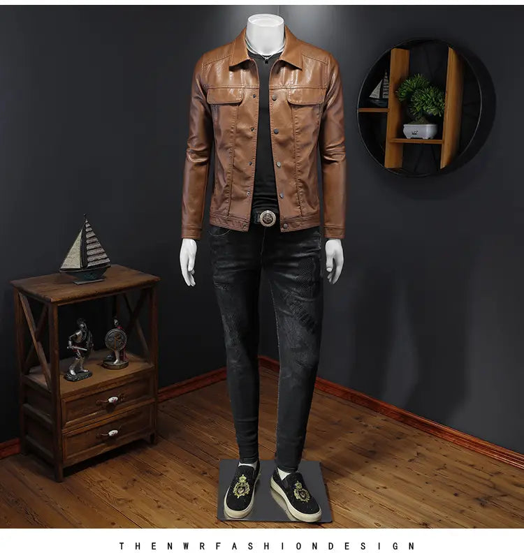 Men’s faux leather button front motorcycle jacket in brown with two front pockets and a collar worn over black clothing on a mannequin.