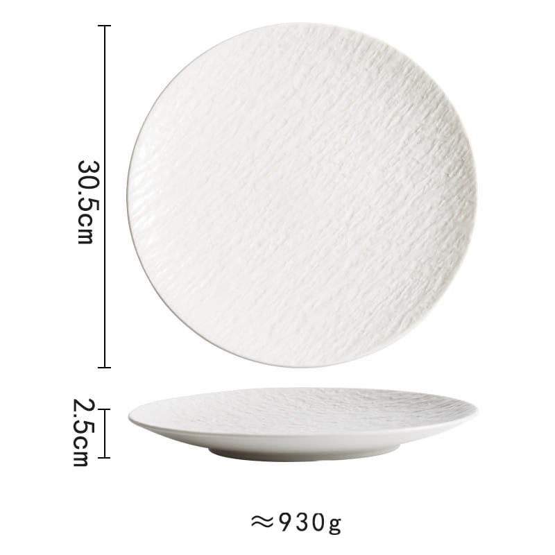 White ceramic round plate with a subtle textured Nordic rock pattern surface and a shallow rim.