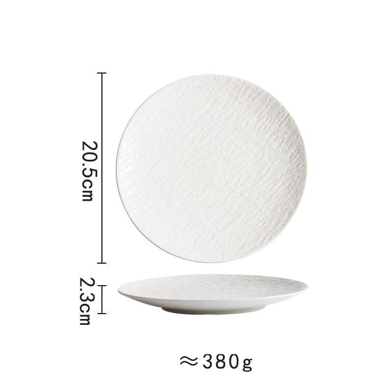 White ceramic round plate with a subtle textured surface and slightly raised rim featuring a nordic rock pattern.