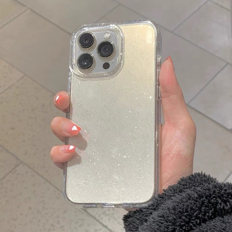 A clear gradient glitter iPhone case with a subtle shimmering finish shown from the back side.