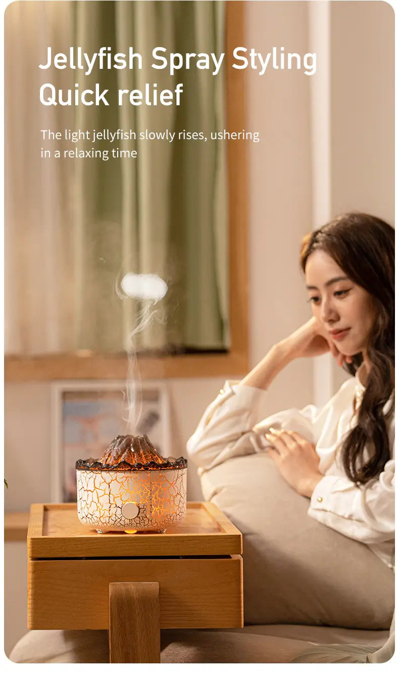 A ceramic volcano essential oil diffuser with a crackled white and gold glaze designed to emit mist like a glowing jellyfish.