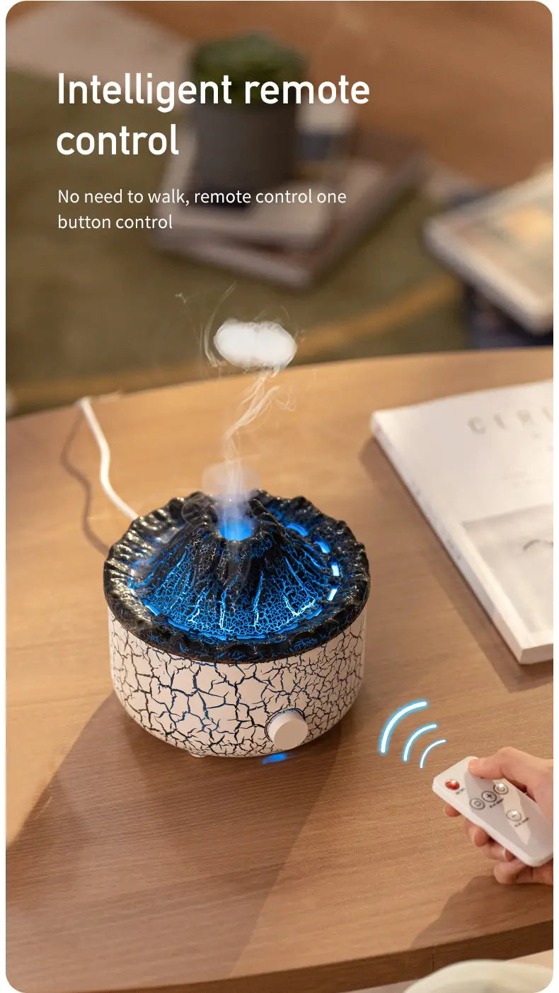Blue-lit volcano essential oil diffuser ceramic flame humidifier with cracked white ceramic base and black volcanic peak designed for smart remote control operation.