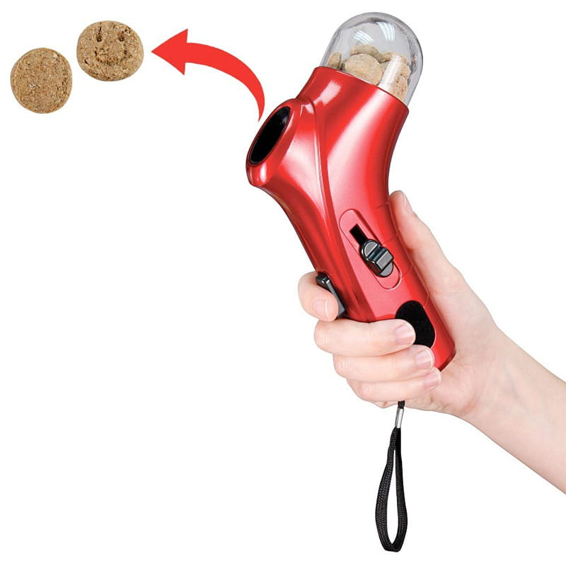 décapsuleur de vin à main rouge pour bouchons, avec un dôme supérieur transparent et des accents de prise noirs, présenté comme un outil d’entraînement pour animaux de compagnie servant de cliquet et de distributeur de friandises.