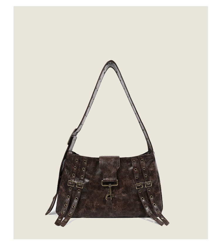 Brown leather punk crossbody bag with rivets featuring dark brown textured leather and metallic hardware accents.