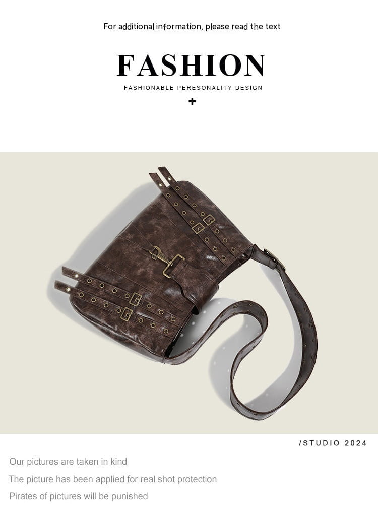 Brown leather punk crossbody bag made of distressed leather with metal buckles straps and rivets.