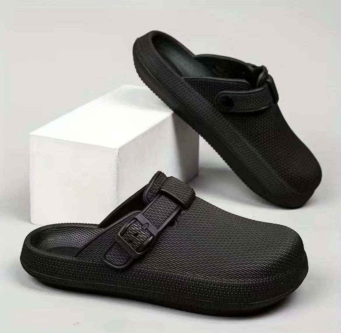 Black textured men lightweight mesh clog slippers with adjustable buckle strap and durable rubber sole.