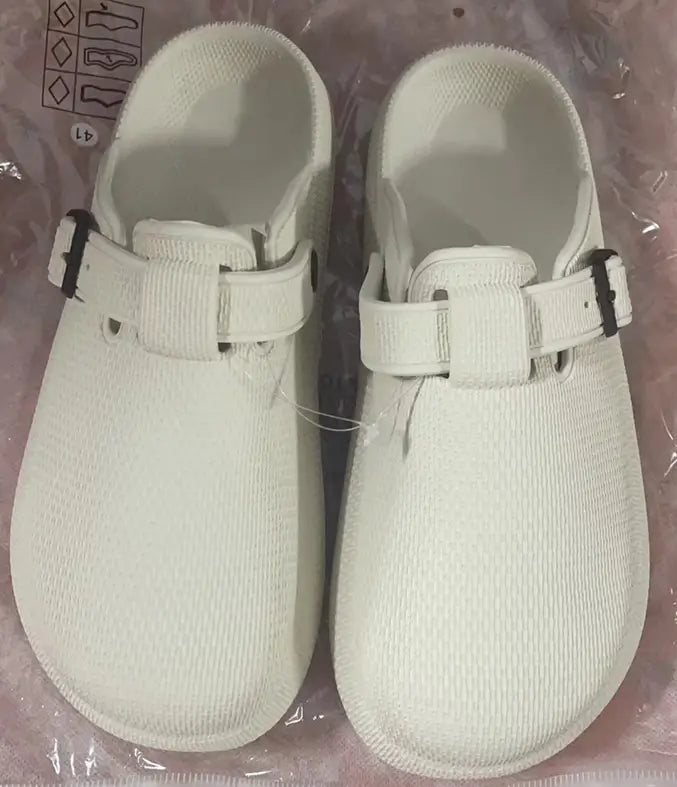 Men lightweight mesh clog slippers in white canvas with adjustable black buckle straps.
