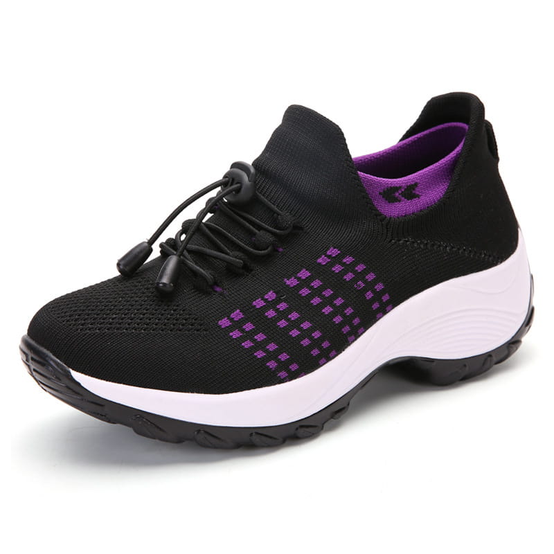 Women’s lightweight fly knit casual sneaker in black with purple accents and a white midsole.