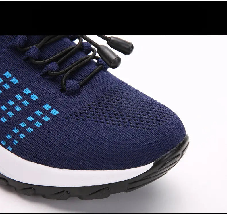 Women’s lightweight fly knit casual sneaker in navy blue with light blue pixel-like patterns and black laces featuring plastic aglets.