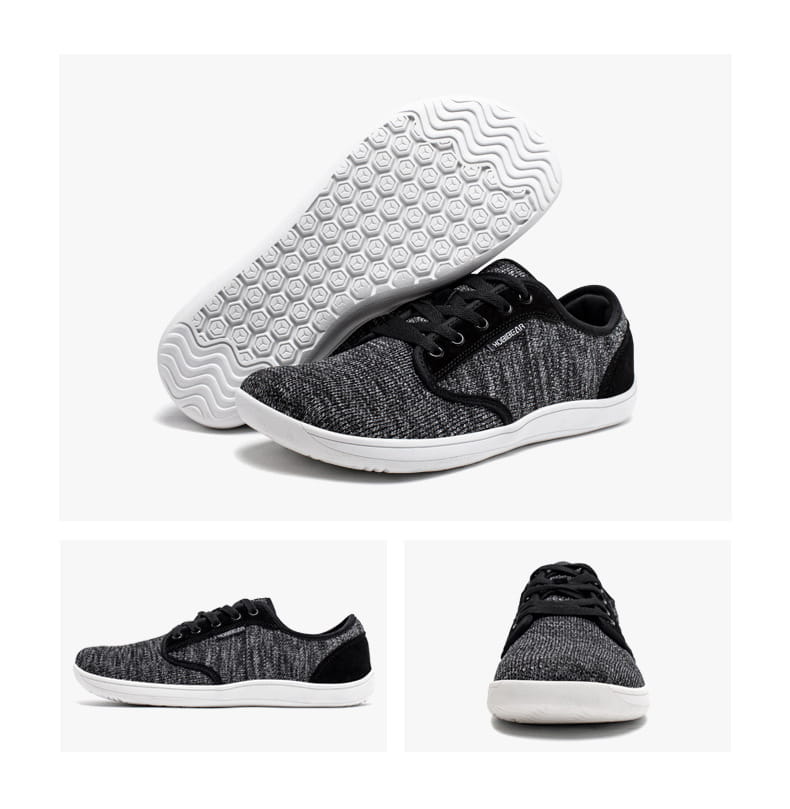 Chaussures de sport décontractées en daim unisexes gs6968 avec dessus en maille tricotée texturée noire et grise, semelles en caoutchouc blanches et lacets noirs.