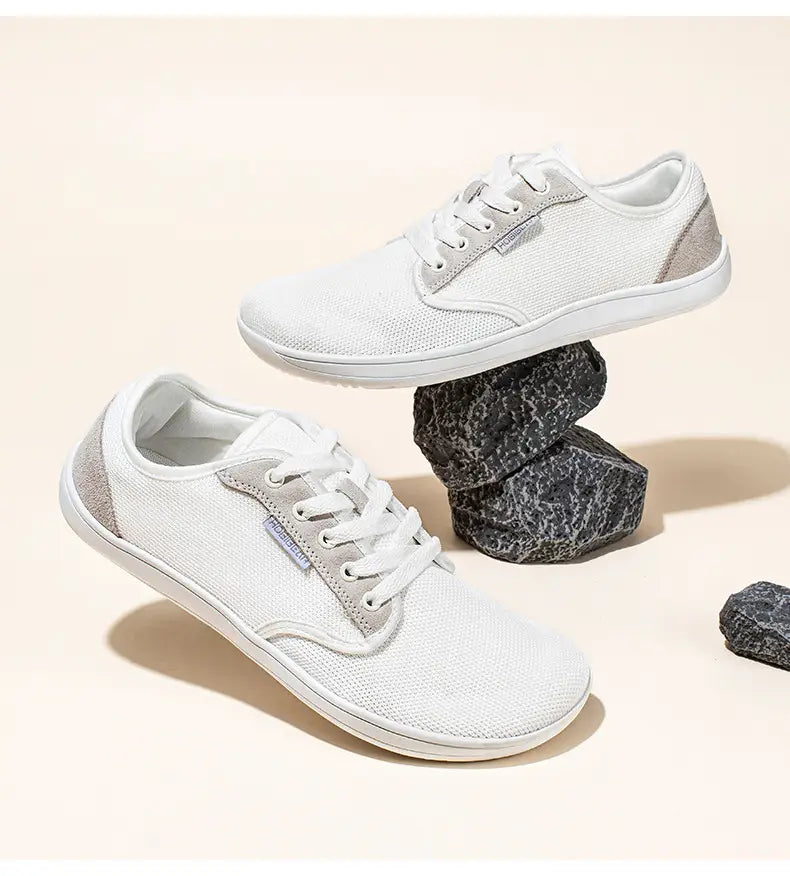 Chaussures de sport décontractées en daim unisexes gs6968 avec toile blanche, finitions en daim gris et lacets blancs dans un design minimaliste.
