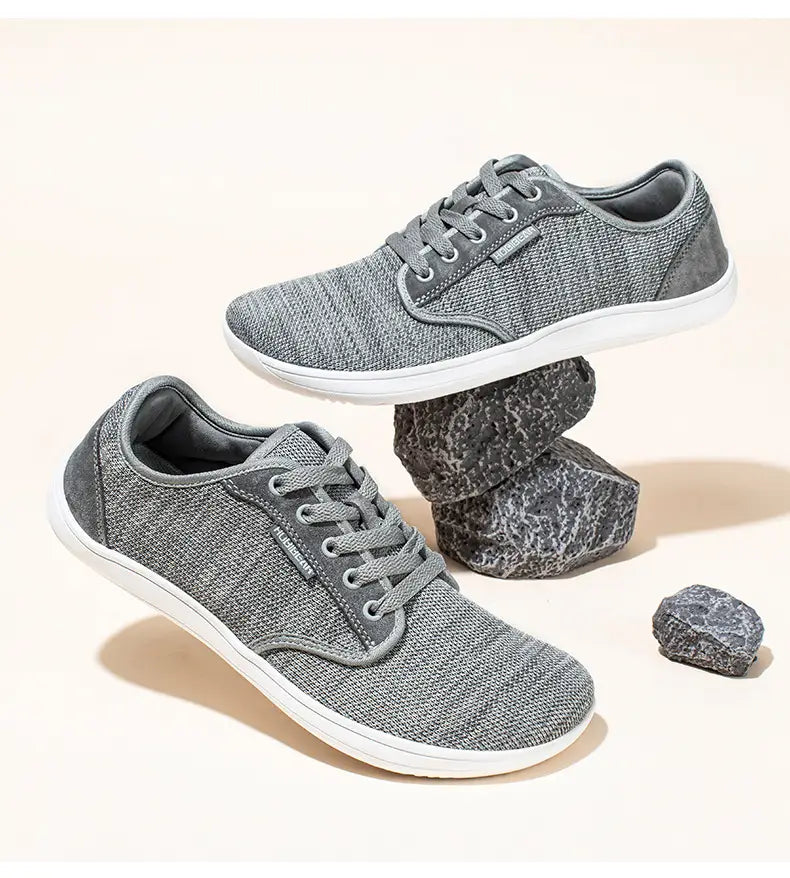 Chaussures de sport décontractées en daim unisexes gs6968 avec baskets en toile tissée grise, semelles en caoutchouc blanches et lacets assortis.