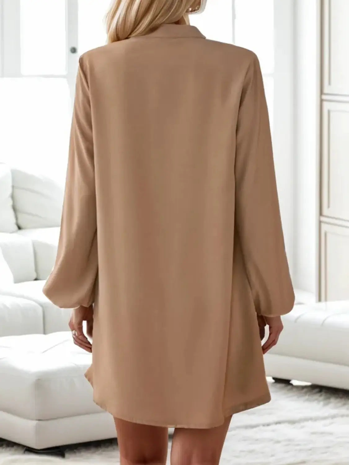 beige bell sleeve button down midi dress featuring long sleeves with a relaxed fit and flowing fabric