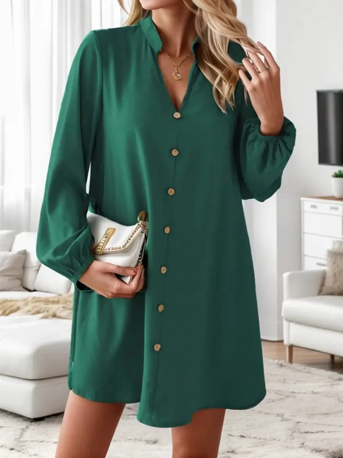Emerald green bell sleeve button down midi dress with a relaxed fit and subtle pleats at the cuffs.