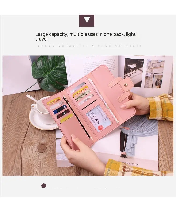 Pink leather women’s tri-fold clutch wallet with multiple card slots and a secure flap closure.