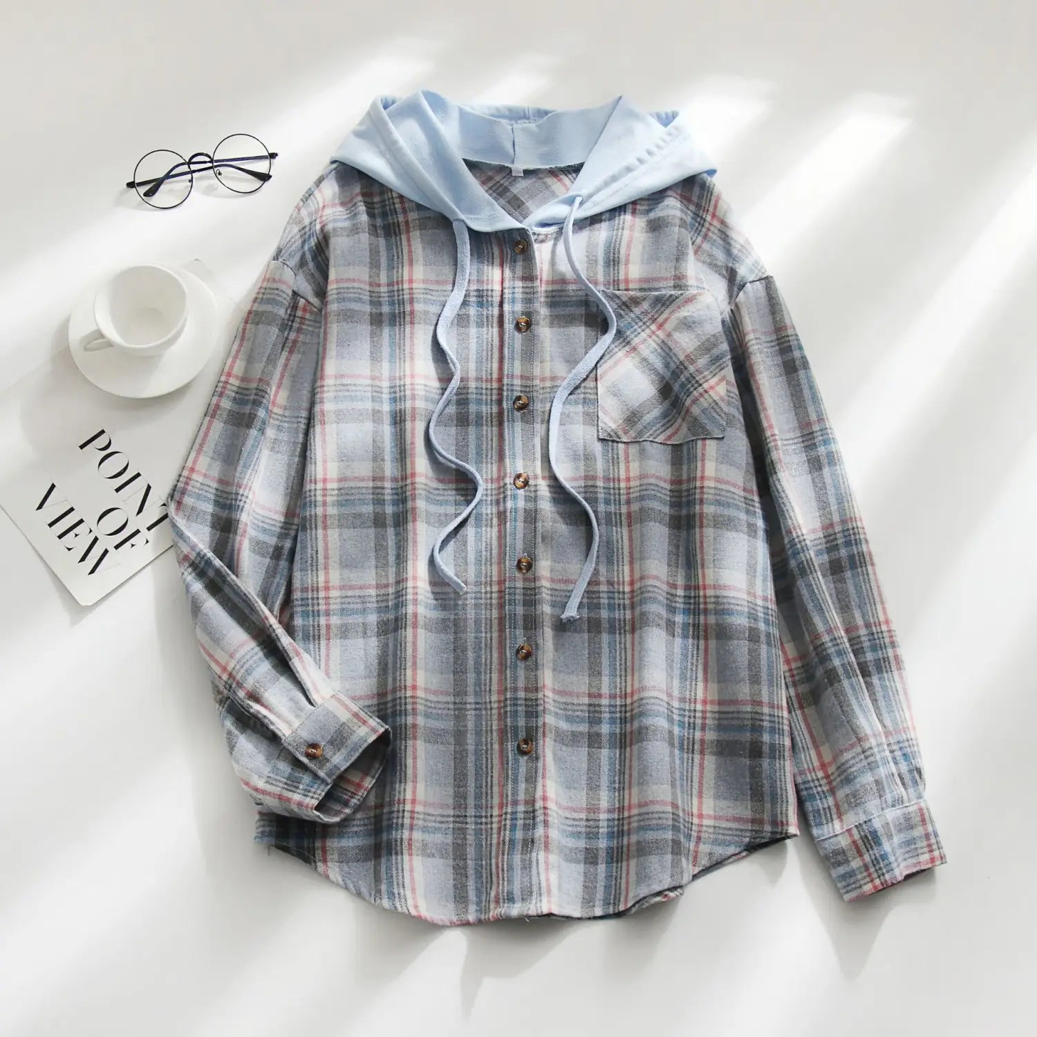 Women’s plaid long sleeve hooded button up shirt in soft gray red and white with a light blue inner lining.