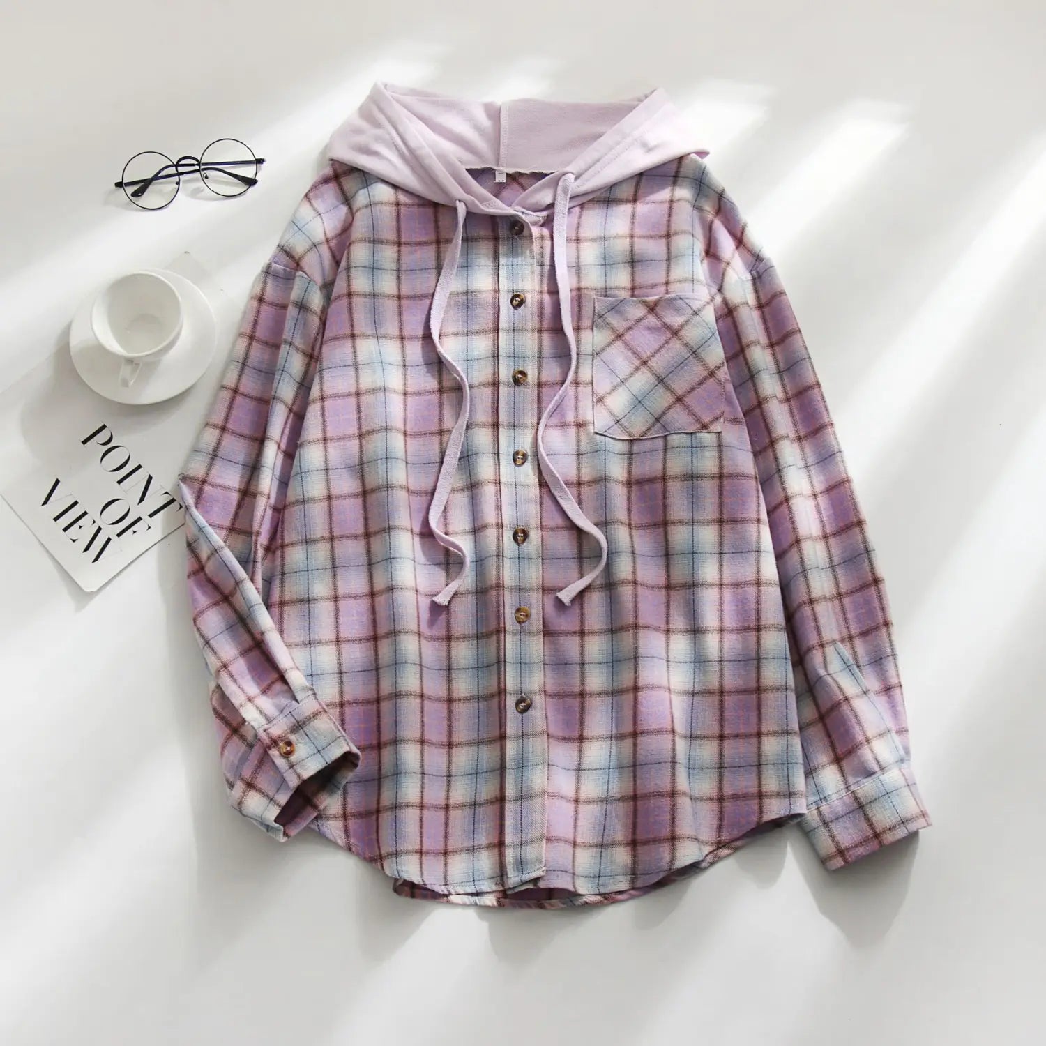 A soft lavender and white plaid long sleeve hooded button up shirt for women featuring a matching drawstring hoodie.
