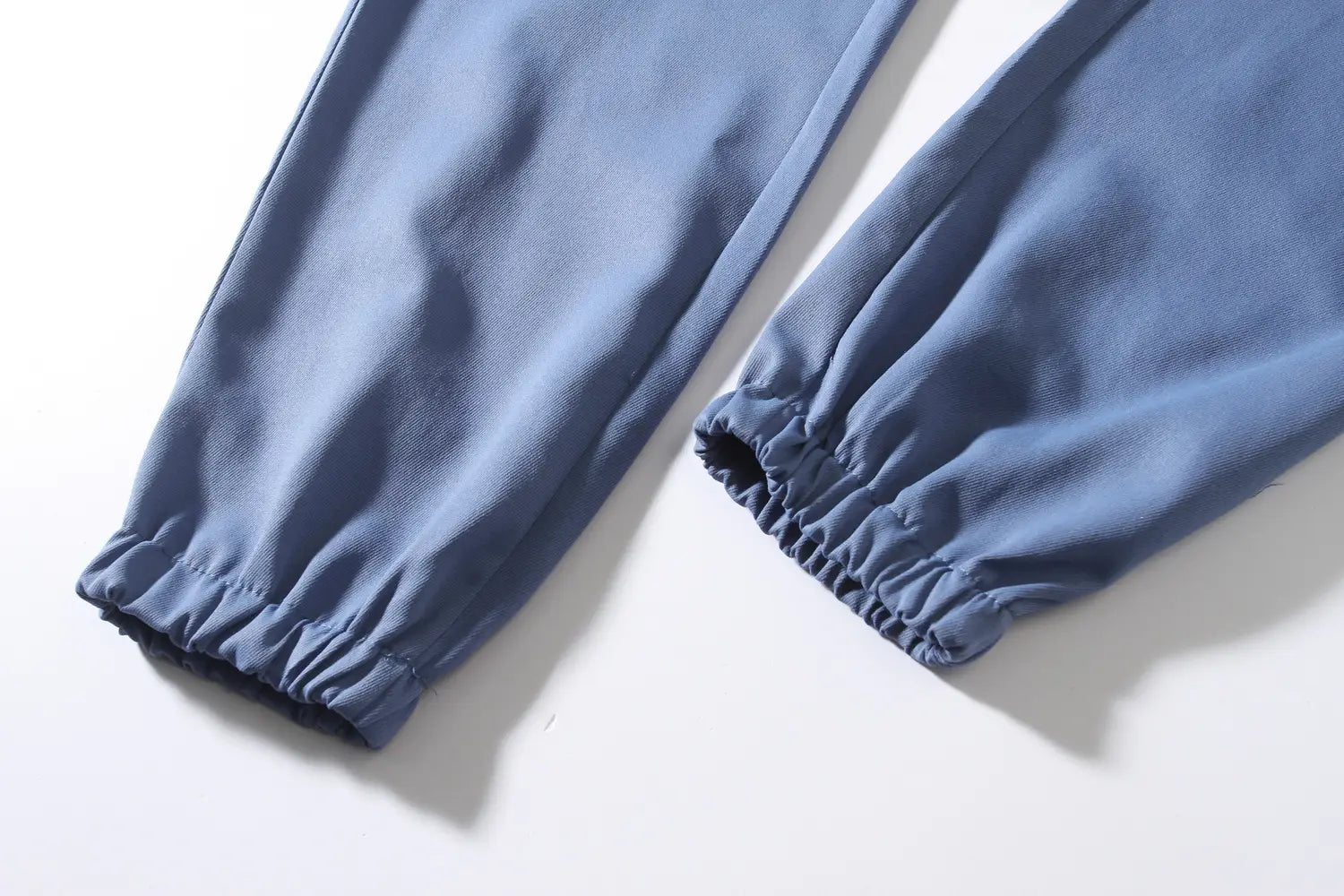 mens multi pocket cargo work pants in blue cotton with elastic cuffs and jogger style suitable for workwear