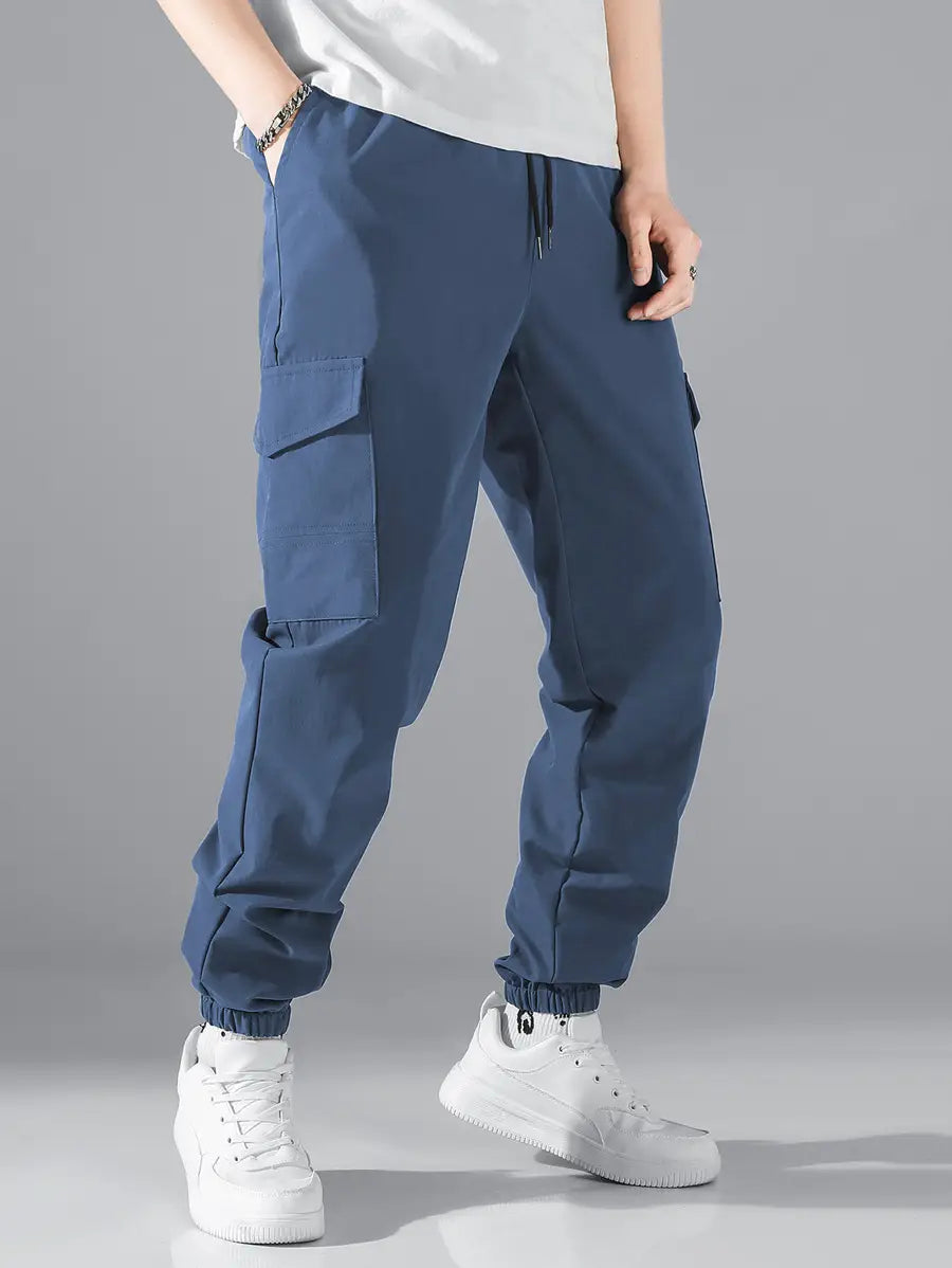 Navy blue mens multi pocket cargo work pants with elastic cuffs and side pockets designed for durability and functionality.