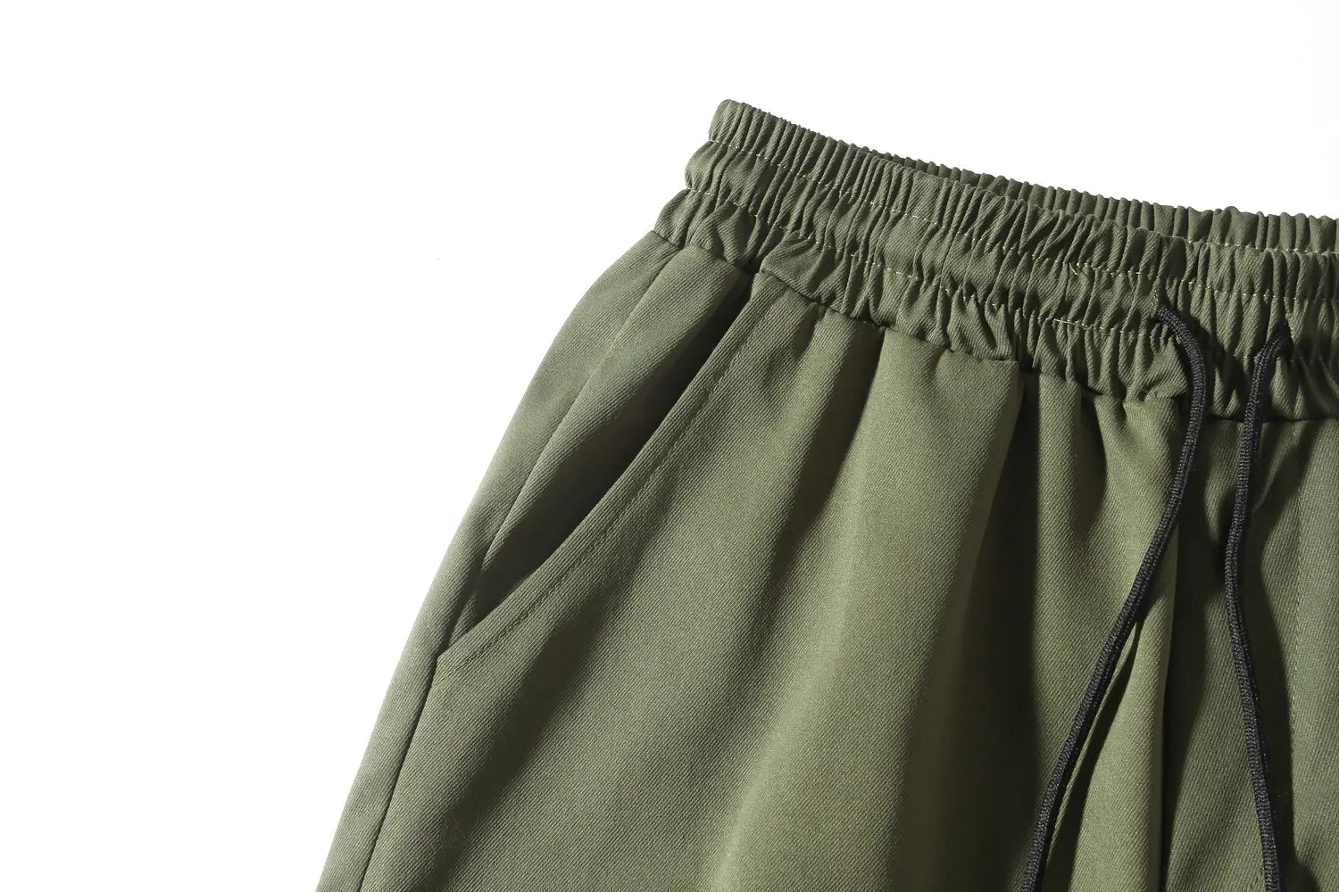 mens multi pocket cargo work pants in olive green with a relaxed fit and subtle textured fabric for durability and comfort.