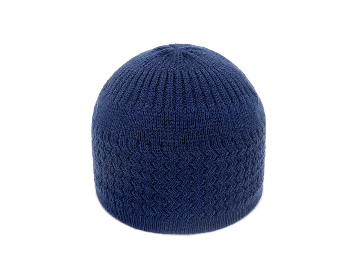 A navy blue knitted jacquard winter beanie hat with ribbed texture and subtle herringbone pattern.