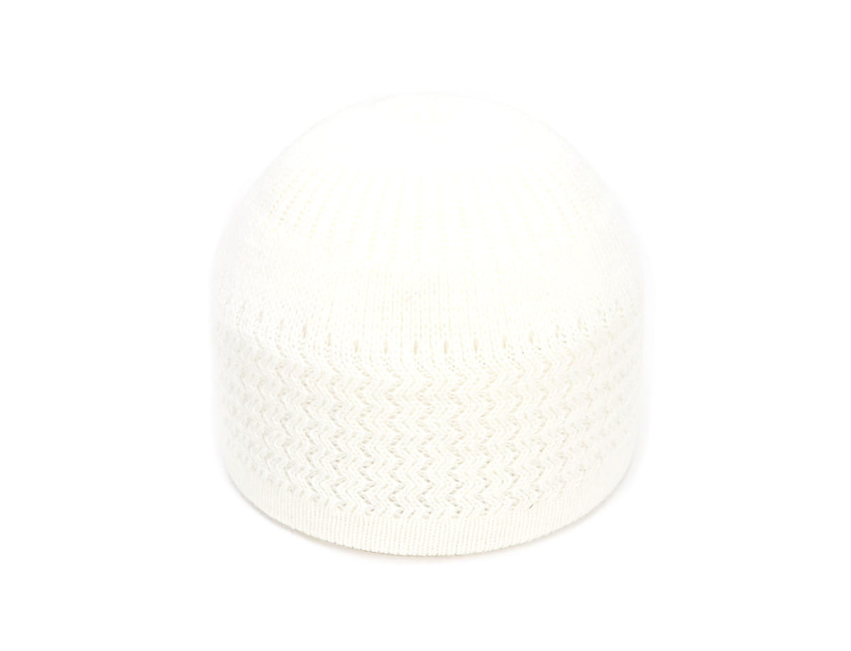 White knitted jacquard winter beanie hat featuring a subtle zigzag pattern made from soft yarn for cold weather use.