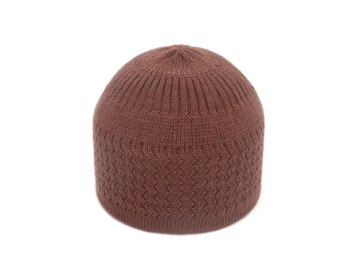a cozy brown knitted jacquard winter beanie hat with a ribbed texture and a subtle chevron pattern