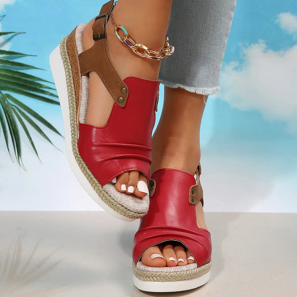 red leather wedge sandals with brown straps and woven espadrille sole designed as peep toe beach shoes for women.