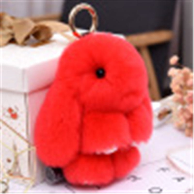 A soft fuzzy red rabbit plush keychain with long floppy ears and a black bead eye measuring 15cm.