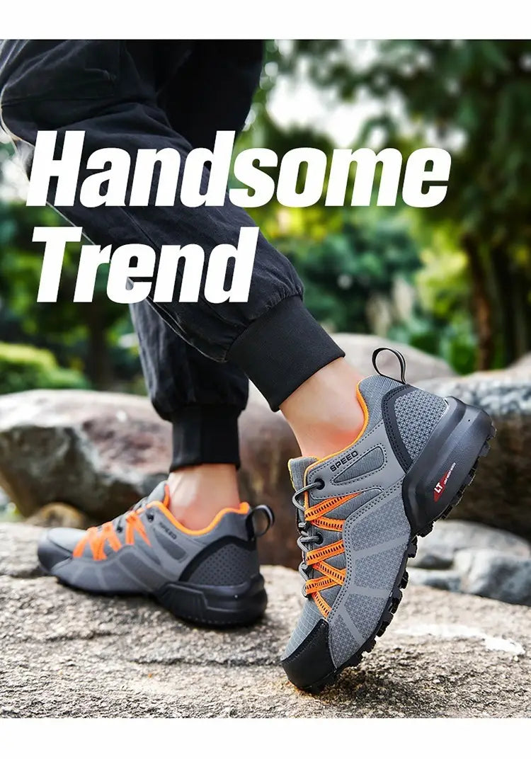 Men’s breathable mesh trail running and hiking shoes in gray and orange with a mesh upper, black rubber sole, and laces.